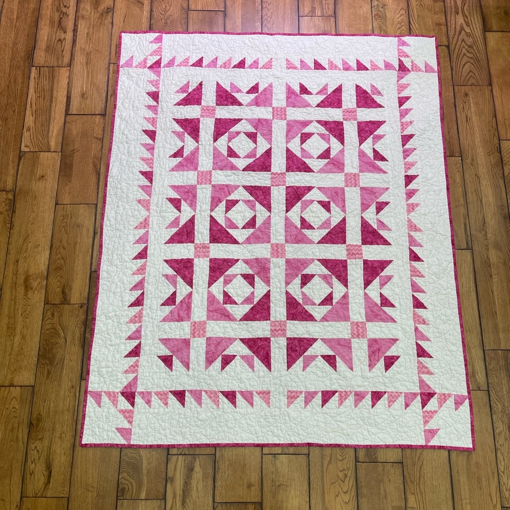 Handmade girls crib size quilt